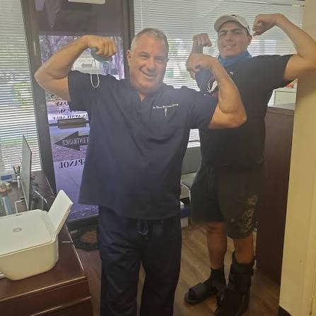 Dr. Brandwein with a team member in the office